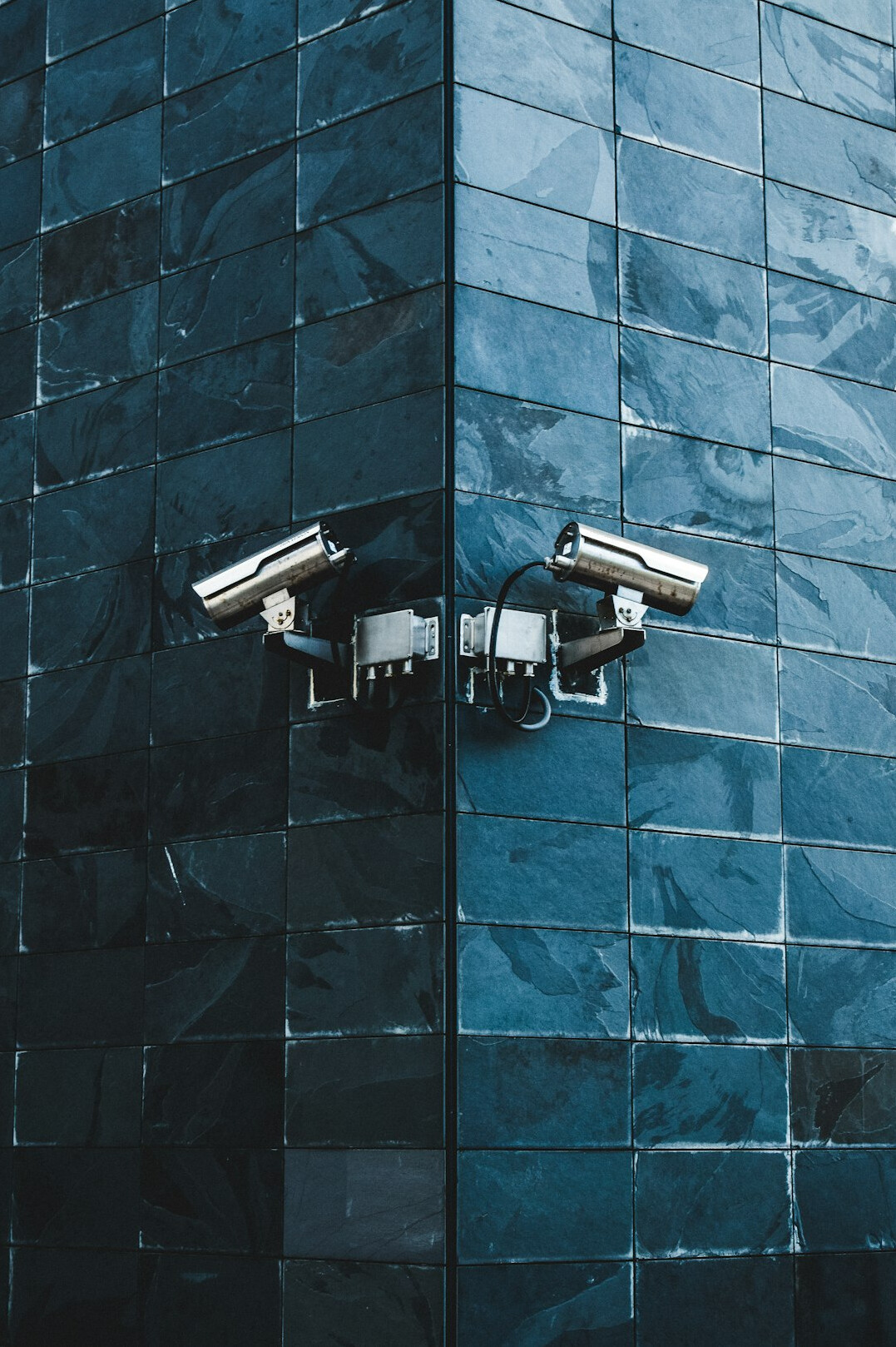 store security guard monitoring cameras