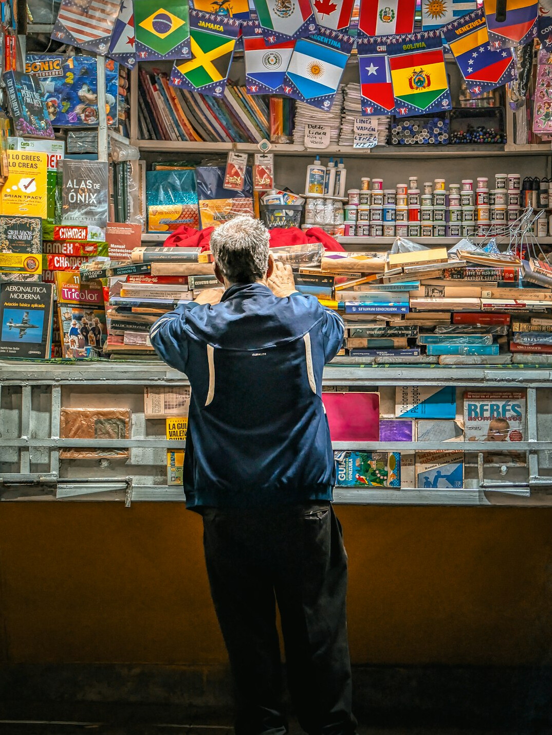 man with backpack in store
